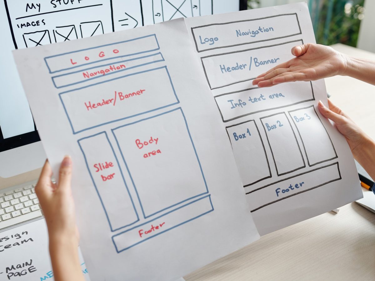 Designers discussing website layouts